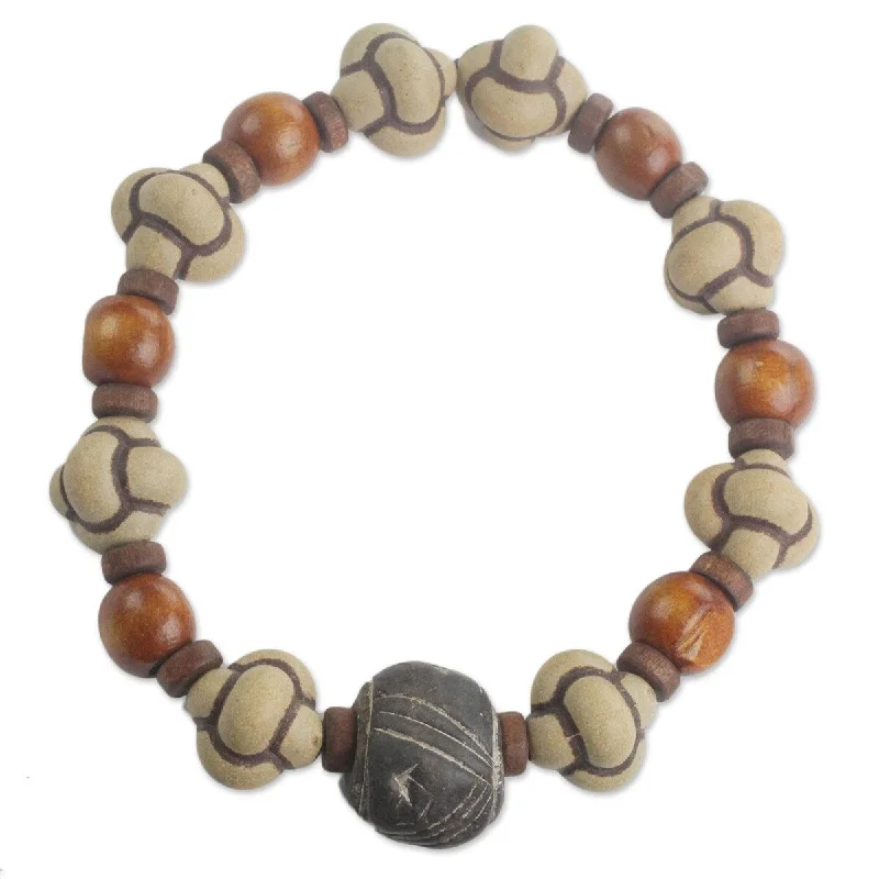 Thread wrap bangles-Space Rings-NOVICA Bold Adventurer, Men's terracotta and wood beaded stretch bracelet